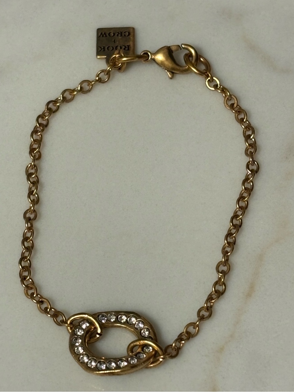 Gold-tone Link Bracelet with Crystal Embellished Link by Rook + Crow